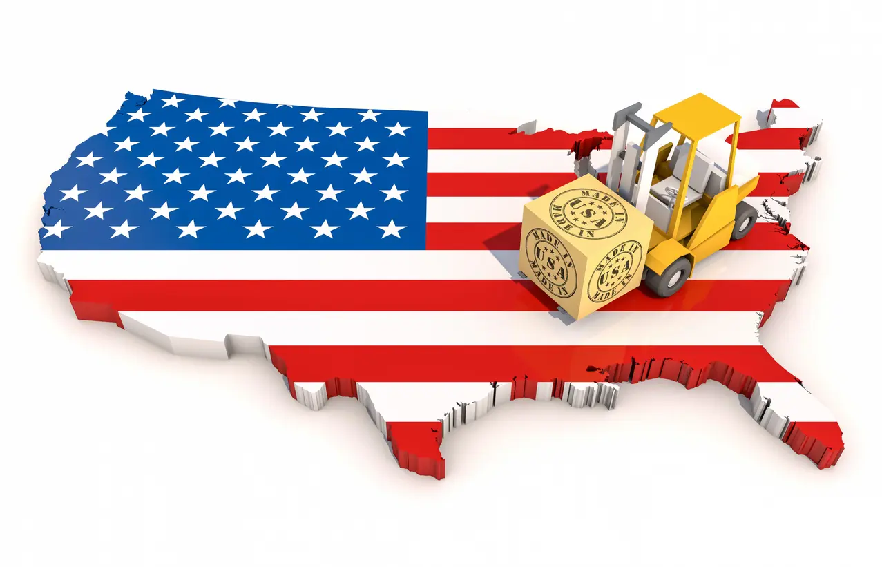 A yellow forklift truck on top of an american flag.