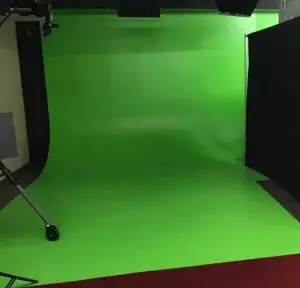 A green screen in the middle of a room.