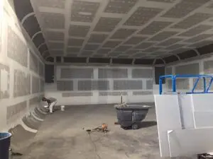 A room with a cement floor and walls